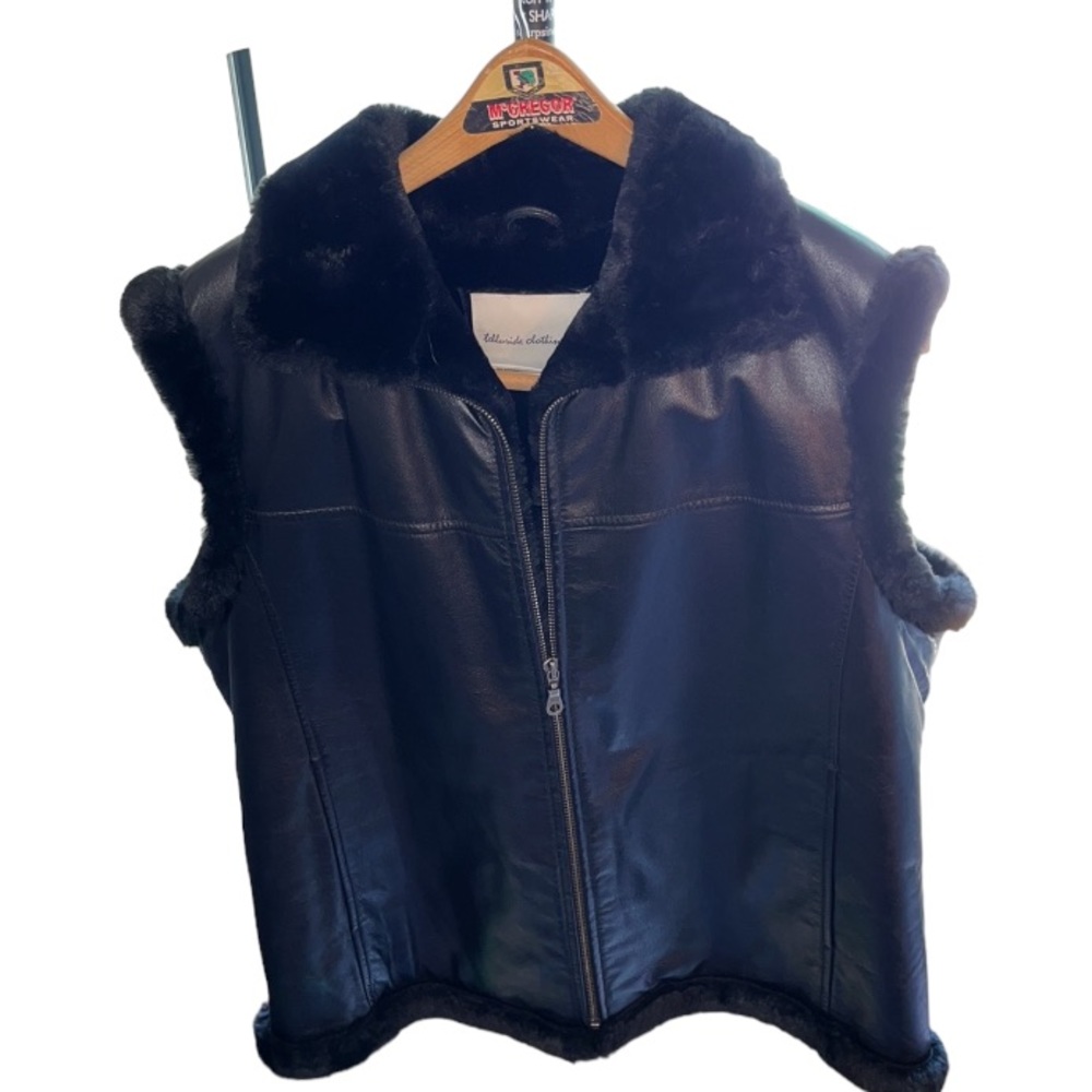 Telluride Collection Co 
Size XL black leather fur lined vest